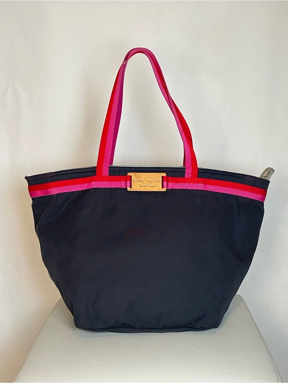 kate spade black tote with pink and red trim